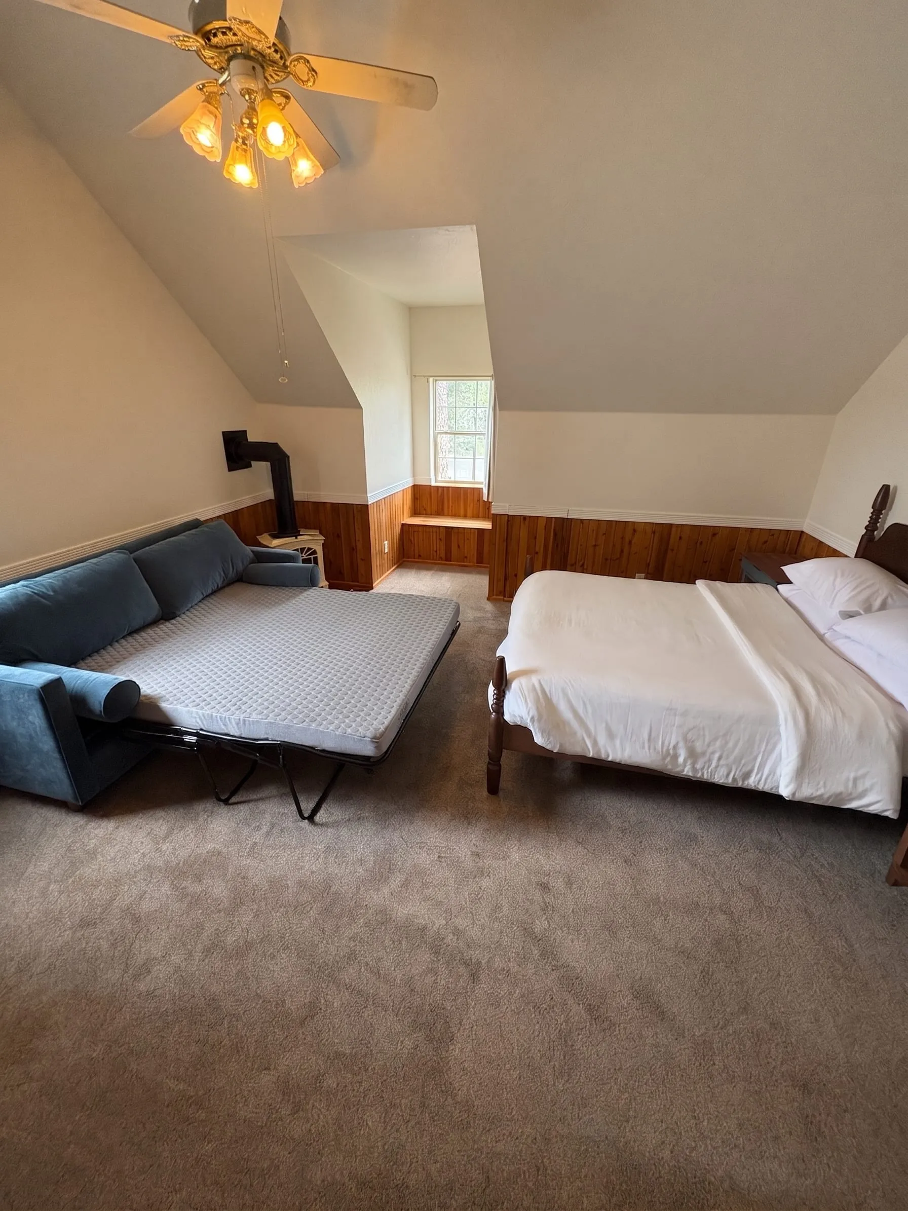 Jane’s Room with the sleeper sofa pulled out into a bed beside the queen.