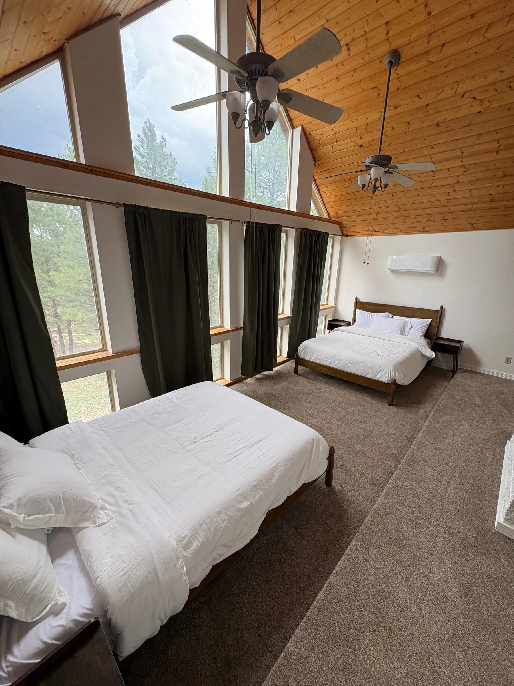 Another angle on the Window Room, showing the bed against the panelled wall.
